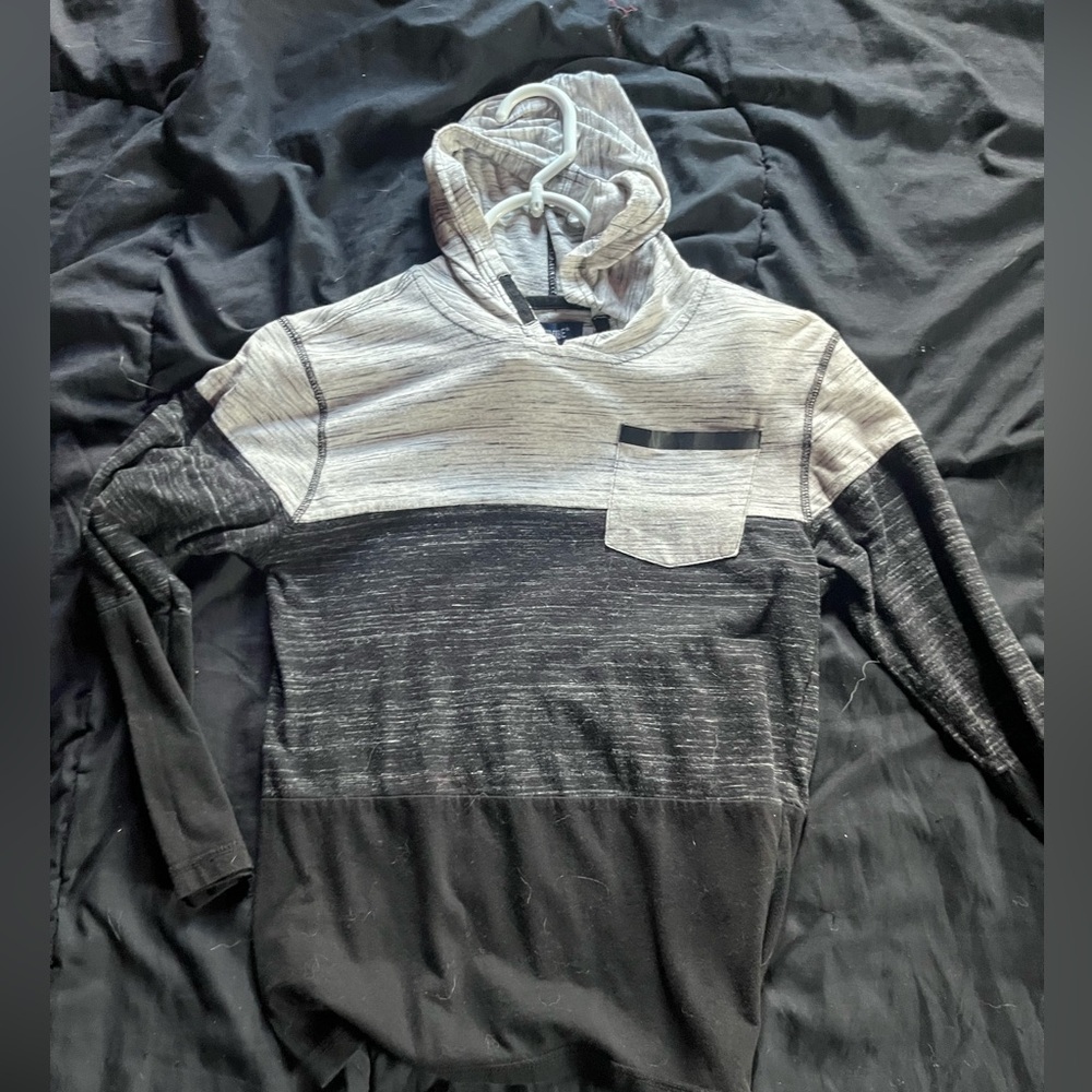 A long sleeve hoodie that's is black and white